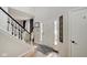 Inviting entryway with a staircase, tiled floor, and a coat rack at 5230 Berkshire South Blvd, Greenwood, IN 46142