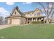 Two-story house with a brick facade, attached garage, and well-manicured lawn at 5230 Berkshire South Blvd, Greenwood, IN 46142