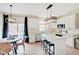 Open concept kitchen featuring white cabinets, an island, and a dining area at 5230 Berkshire South Blvd, Greenwood, IN 46142