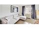 Relaxing living room with a sectional sofa and large windows providing natural light at 5230 Berkshire South Blvd, Greenwood, IN 46142