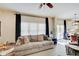 Spacious living room featuring a sofa and access to the kitchen at 5230 Berkshire South Blvd, Greenwood, IN 46142