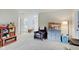 Playroom features a comfy armchair, storage, and access to a bathroom at 5230 Berkshire South Blvd, Greenwood, IN 46142