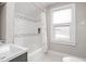 Updated bathroom with subway tile and a shower/tub combo at 5460 E University Ave, Indianapolis, IN 46219