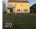 House with covered patio and grassy backyard at 6628 Heben Ct, Indianapolis, IN 46113
