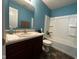 Clean bathroom with a shower/tub combo and wood vanity at 6628 Heben Ct, Indianapolis, IN 46113