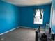 Charming bedroom with blue walls and a window with a view at 6628 Heben Ct, Indianapolis, IN 46113