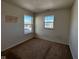 Well-lit bedroom with neutral walls and carpet flooring at 6628 Heben Ct, Indianapolis, IN 46113