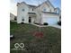 Two-story house with attached garage and tree in front yard at 6628 Heben Ct, Indianapolis, IN 46113