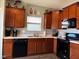 Modern kitchen with stainless steel appliances and wood cabinets at 6628 Heben Ct, Indianapolis, IN 46113