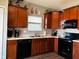 Modern kitchen with stainless steel appliances and wood cabinets at 6628 Heben Ct, Indianapolis, IN 46113