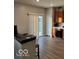 Kitchen with hardwood floors, wooden cabinets, and sliding door to backyard at 6628 Heben Ct, Indianapolis, IN 46113