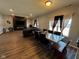 Spacious living room featuring a fireplace and dark wood floors at 6628 Heben Ct, Indianapolis, IN 46113
