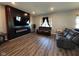 Living room with fireplace and dark wood floors at 6628 Heben Ct, Indianapolis, IN 46113
