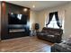 Living room with fireplace and dark wood floors at 6628 Heben Ct, Indianapolis, IN 46113