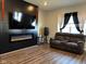 Living room with fireplace and dark wood floors at 6628 Heben Ct, Indianapolis, IN 46113