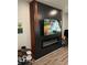 Modern media wall features a large TV and electric fireplace at 6628 Heben Ct, Indianapolis, IN 46113