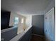 Upper hallway with gray walls and carpet flooring at 6628 Heben Ct, Indianapolis, IN 46113