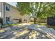 Backyard featuring a patio, wooden fence, and ample shade for relaxation at 7129 Dublin Ln, Indianapolis, IN 46239
