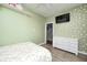 Bright bedroom features a ceiling fan, neutral flooring, and built in storage at 7129 Dublin Ln, Indianapolis, IN 46239