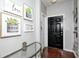 Inviting entryway with dark wood floors and decorative artwork leading into the home at 7129 Dublin Ln, Indianapolis, IN 46239
