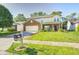 Charming two-story home with brick facade and a well-manicured lawn at 7129 Dublin Ln, Indianapolis, IN 46239