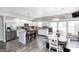 Bright kitchen with stainless steel appliances, white cabinets, island seating, and lots of light at 7129 Dublin Ln, Indianapolis, IN 46239