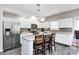 Modern kitchen featuring stainless steel appliances, white cabinets, an island, and stylish pendant lighting at 7129 Dublin Ln, Indianapolis, IN 46239