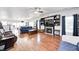 Spacious living room with hardwood floors, a fireplace, and abundant natural light at 7129 Dublin Ln, Indianapolis, IN 46239