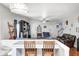 Spacious living room with hardwood floors, fireplace, and open layout to the kitchen and dining area at 7129 Dublin Ln, Indianapolis, IN 46239