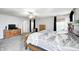 Large main bedroom features a ceiling fan, dresser, and en-suite bathroom at 7129 Dublin Ln, Indianapolis, IN 46239