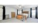 Spacious main bedroom features large windows, hardwood furniture, and a ceiling fan at 7129 Dublin Ln, Indianapolis, IN 46239