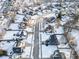 Aerial view of a residential neighborhood blanketed in winter snow at 7620 Baywood S Dr, Indianapolis, IN 46236