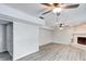 Living room with fireplace and wood-look flooring at 7824 Rosebush Dr, Indianapolis, IN 46237