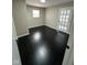 Bedroom with dark hardwood floors and French doors at 835 E Berwyn St, Indianapolis, IN 46203