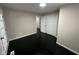 Bright bedroom with dark hardwood floors and exterior access at 835 E Berwyn St, Indianapolis, IN 46203