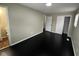 Spacious bedroom with dark hardwood floors and en-suite bathroom at 835 E Berwyn St, Indianapolis, IN 46203
