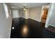 Living room with dark hardwood floors and kitchen view at 835 E Berwyn St, Indianapolis, IN 46203
