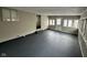 Sunroom with gray flooring and access to backyard at 835 E Berwyn St, Indianapolis, IN 46203