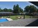 Large backyard with inground pool, grassy area, and playset at 930 River Rd, Columbus, IN 47203