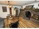 Farmhouse-style dining room with fireplace and wooden table at 930 River Rd, Columbus, IN 47203