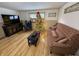 Living room with hardwood floors, Christmas tree and comfy seating at 930 River Rd, Columbus, IN 47203