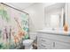 Bathroom featuring a single sink vanity, toilet and a shower with a whimsical animal themed curtain at 943 Aurora Ln, Franklin, IN 46131