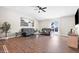 Open concept living room with hardwood floors and a large window at 943 Aurora Ln, Franklin, IN 46131