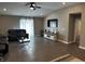 Living room with dark wood floors, ceiling fan and entertainment center at 943 Aurora Ln, Franklin, IN 46131