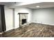 Spacious basement with a stone fireplace and wood-look flooring at 9518 Bay Vista Edr, Indianapolis, IN 46250