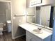 Clean bathroom with white vanity and updated mirror at 9518 Bay Vista E Dr, Indianapolis, IN 46250