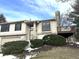 Beige exterior home with a deck, landscaping, and attached garage at 9518 Bay Vista E Dr, Indianapolis, IN 46250