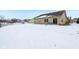 Snow-covered backyard with view of neighboring homes at 11537 Jagged Rock Ct, Fishers, IN 46037