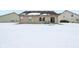 Snow covered backyard view of home at 11537 Jagged Rock Ct, Fishers, IN 46037