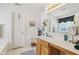 Bathroom with double vanity and a large mirror at 11537 Jagged Rock Ct, Fishers, IN 46037